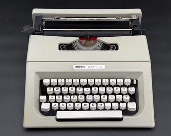 Vintage 1970s Olivetti Lettera 30 manual typewriter with soft carry case