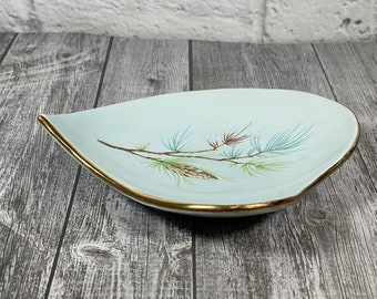 Mid century vintage decorative plate with robin's egg blue glaze, pine cone decoration and gold edges