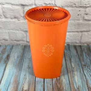 Vintage 1970s bright orange round Tupperware canister with lid 10.5" tall