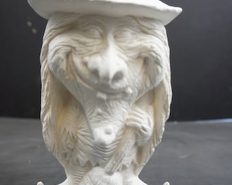 May include: White ceramic figurine of a witch with a pointed hat, long hair, and a broom. The witch is smiling and holding the broom in her hands.