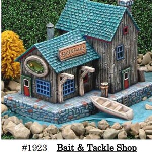 May include: A miniature Bait & Tackle Shop with a weathered wood appearance, teal roof, and stone foundation. Features a sign, a boat, and a fish emblem. Dimensions are 6x6x5 inches.