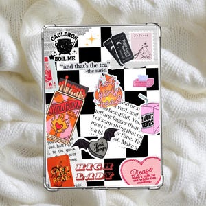 May include: Clear phone case with a black and white checkered pattern, adorned with stickers. Stickers include text like "Cauldron Boil Me", "Slowburn Matches", "Hot Girls Read", and "High Lady".
