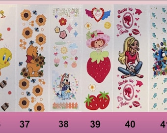 May include: Six sheets of colorful stickers featuring various cartoon characters. The stickers include Winnie the Pooh, Tweety Bird, a strawberry, a blue dog, a girl with blonde hair, and a blue dog with a rainbow.