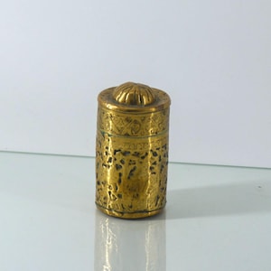 Decorated brass caddy