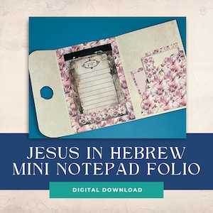 May include: A mini notepad folio with a floral design. The notepad has a pink and white floral pattern and the text "Yeshua" in Hebrew. The folio has a pocket for the notepad and a separate pocket for a pen.