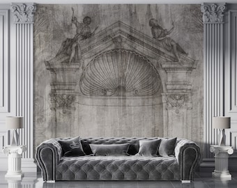 Könnte beinhalten: Ein graues, gestepptes Sofa mit einem Dekokissen vor einer Wand mit einer schwarz-weißen Architekturzeichnung eines Torbogens.