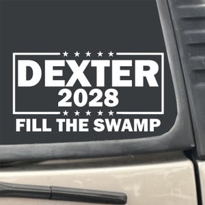 DEXTER 2028 Fill The Swamp Campaign 7&quot; x 3.75&quot; Funny TV Show White Vinyl Transfer Decal Sticker for Car, Truck, RV, Boat, Laptop etc…