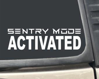 Sentry Mode Activated Tesla 7" x 2" White Vinyl Transfer Decal Sticker for Car, Truck, RV, Boat, Laptop etc…