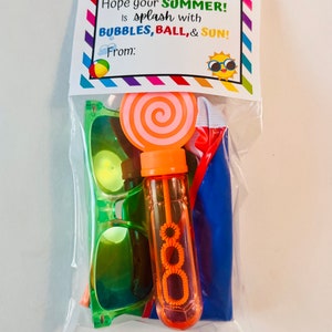 May include: A clear plastic bag filled with summer-themed party favors. The bag contains a pair of green sunglasses, a bubble wand, a blue beach ball, and a pink and orange lollipop. The bag has a tag that reads "Hope your SUMMER! Is splash with BUBBLES, BALL, & SUN! From:"