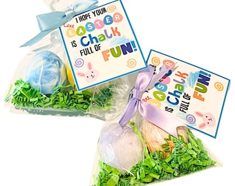 May include: Two clear cellophane bags filled with green shredded paper and colorful bath bombs. Each bag has a tag attached with the text "I hope your Easter is Chalk Full of Fun!"