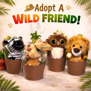 May include: Four plush animal toys, including a zebra, giraffe, owl, and lion, presented in brown paper pots. The text "Adopt A WILD FRIEND!" is displayed above the toys, with a small tag on the giraffe that reads "Adopt A Wild Friend!"