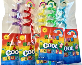 May include: Four colorful spiral straws with rainbow and cloud toppers. Each straw is packaged with a card that says "Have a Cool Summer" with a smiling sun and a popsicle graphic.