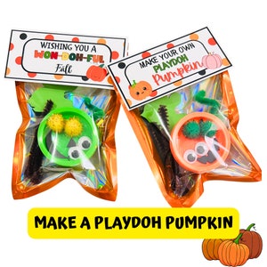 May include: Two orange cellophane bags with craft supplies for making a playdough pumpkin. The bags have printable tags that say "Wishing you a Won-Doh-Ful Fall" and "Make Your Own Playdoh Pumpkin".