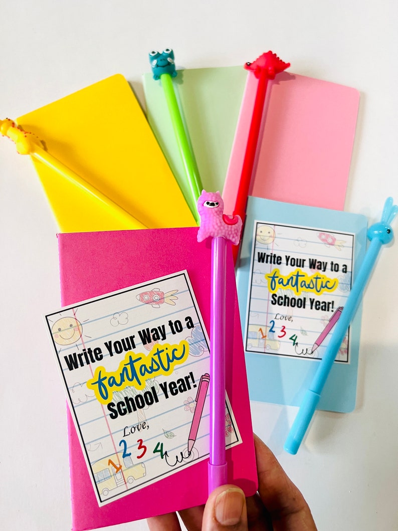 May include: A set of five colorful notebooks with fun animal-shaped pens. Each notebook has a sticker that says "Write Your Way to a Fantastic School Year!" and includes a handwritten message with the number "234".