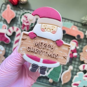 Sello de galletas con relieve emergente de letras de Feliz Navidad de Santa Claus con cortador de galletas a juego