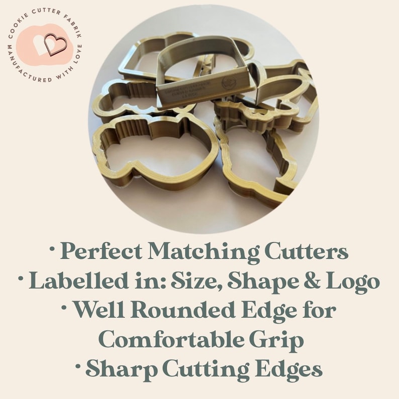 May include: A collection of gold-colored cookie cutters in various shapes, including a mug, cloud, and other designs. The cutters are labeled with size, shape, and logo information. The image also includes text that says "COOKIE CUTTER FABRIK MANUFACTURED WITH LOVE."