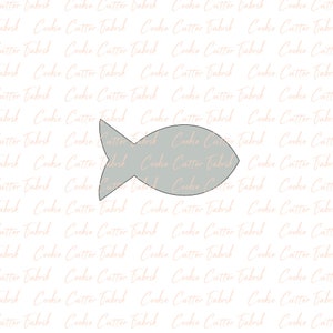 May include: A gray fish-shaped cookie cutter. The cutter is on a white background with a repeating pattern of the text "Cookie Cutter Tabrik".