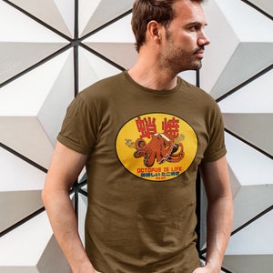 May include: A brown t-shirt with a yellow circle graphic featuring an octopus with the text "Octopus is Life" and Japanese characters.