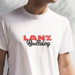 May include: White t-shirt with a red "LANZ" and black "Bulldog" graphic.