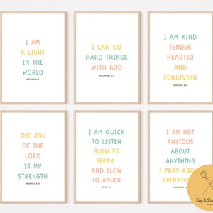 May include: Six printable wall art prints with inspirational quotes and bible verses in a light pink, yellow, and blue color scheme. The prints feature the following text: "I am a light in the world", "I can do hard things with God", "I am kind, tender hearted and forgiving", "The joy of the Lord is my strength", "I am quick to listen, slow to speak and slow to anger", and "I am not anxious about anything, I pray about everything".