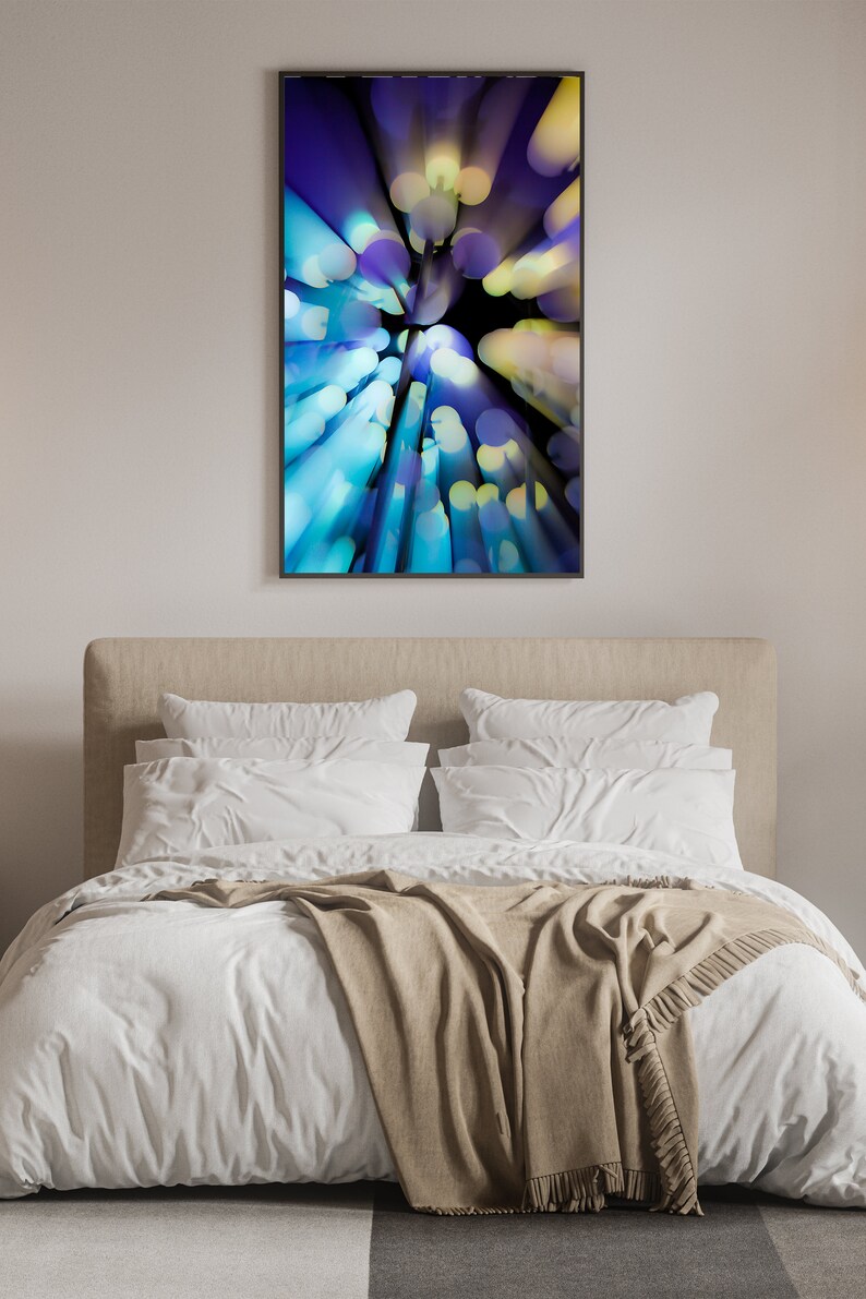 May include: Abstract art print with a blue, yellow and purple colour scheme. The print features a swirling pattern of circles and lines.