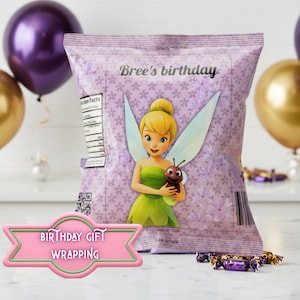 May include: A lavender-colored gift bag with a Tinkerbell graphic and the text "Bree's birthday." The bag is decorated with small white flowers and a pink banner that says "Birthday Gift Wrapping."