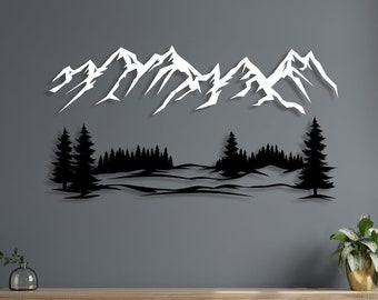 May include: Black metal wall art depicting a mountain range with snow-capped peaks and a forest in the foreground. The art is mounted on a gray wall above a wooden shelf.
