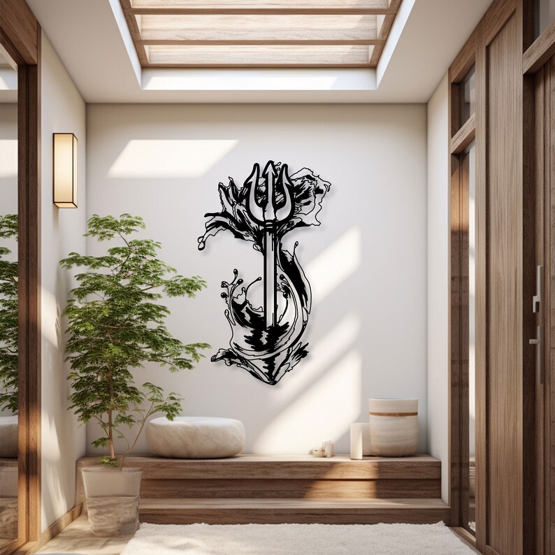 May include: Black metal wall art depicting a trident with waves crashing around it. The art is mounted on a white wall in a modern home interior.