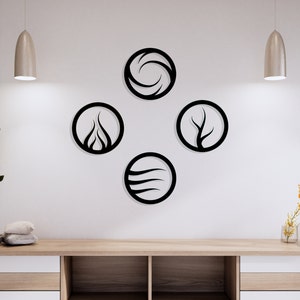 May include: Four black metal wall decor circles with stylized designs representing the four elements: water, fire, earth, and air. The circles are arranged in a diamond shape on a white wall.