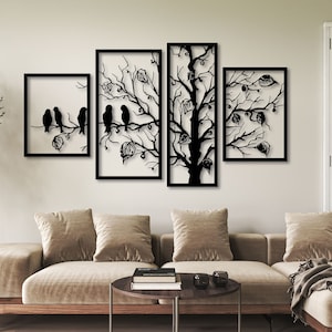 May include: Black metal wall art featuring a silhouette of a tree with birds perched on branches. The art is divided into four panels, with the birds on the leftmost panel and the tree extending across the other three panels.