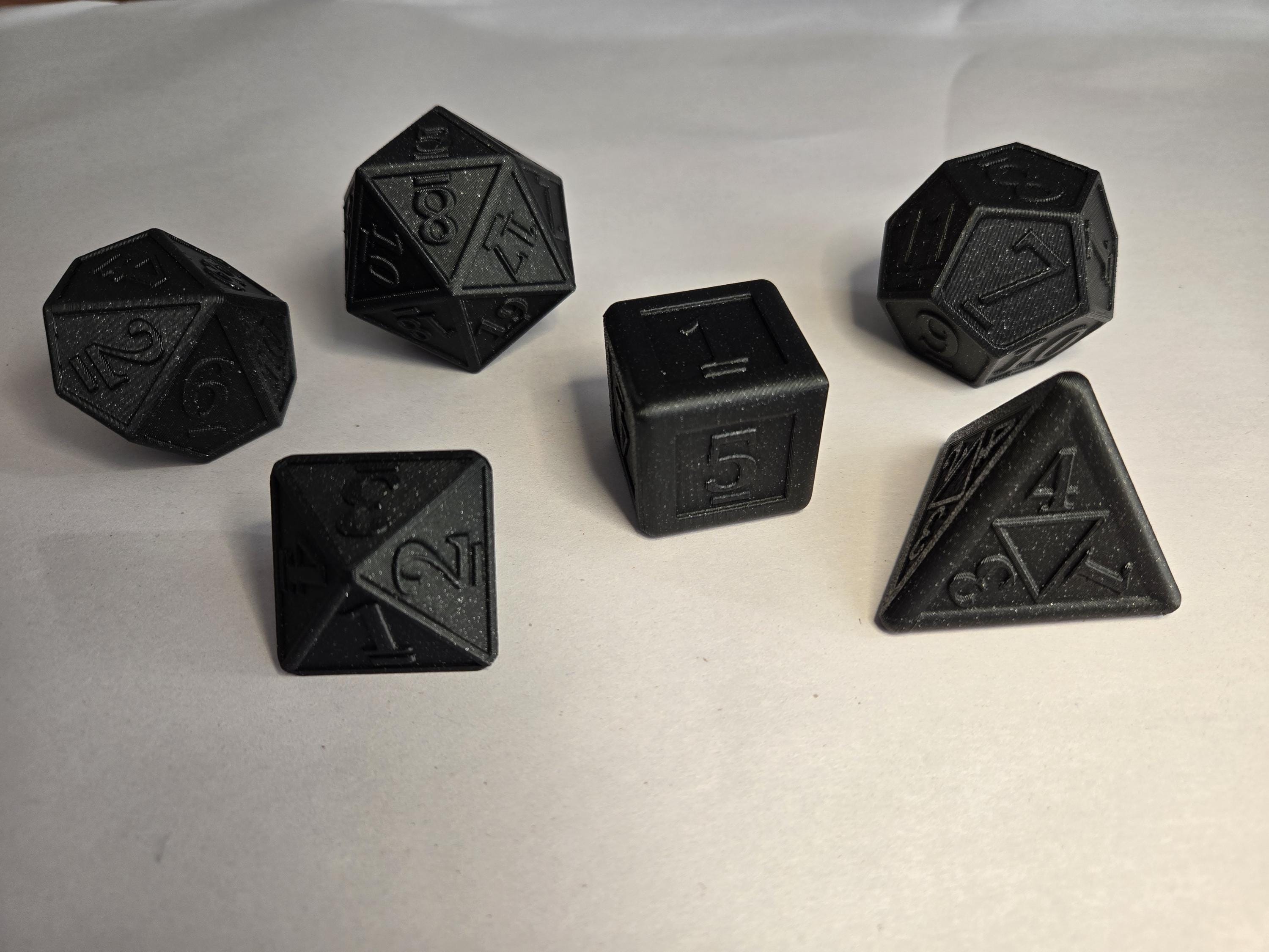 Set of six black dice, D4, D6, D8, D10, D12 and D20, with raised print numbers on every face.