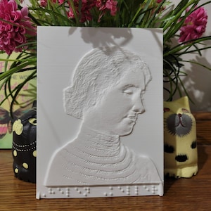 Helen Keller tactile photo with braille