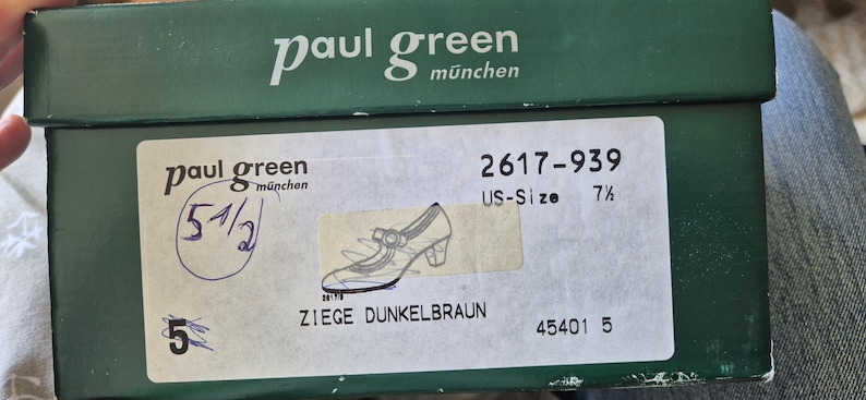 May include: A green shoe box with the brand name "paul green m&uuml;nchen" printed in white. The box has a label with a shoe illustration and the text "ZIEGE DUNKELBRAUN". The US size is 7 1/2.