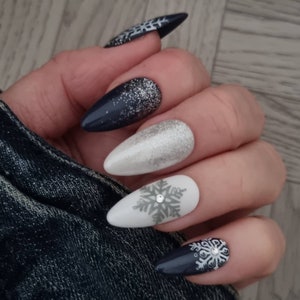 Snowflake nails  blue press on nails.  christmas Almond nails . Press on nails in the uk.