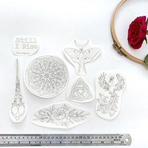 Stick & Stitch &quot;Still I Rise&quot; Water Soluble Hand Embroidery Designs, 7 Transfers: Scissors, Window, Phoenix, Peony, Celtic Knot, Moth, Quote