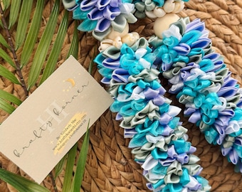 Light Purple/Aqua Blue/Sage Green and White Ribbon Flower Lei with cowrie shells.