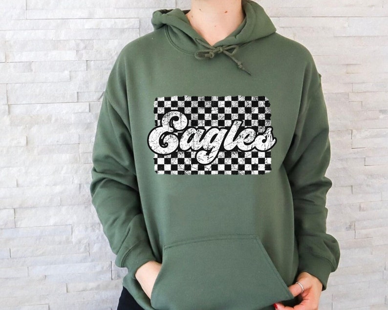 May include: A green hooded sweatshirt with a white checkered background and the word "Eagles" in a retro font.