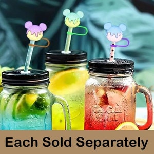 May include: Three mason jars with lids and handles, filled with different colored liquids. Each jar has a colorful straw with a Mickey Mouse head topper. The text "Each Sold Separately" is at the bottom of the image.