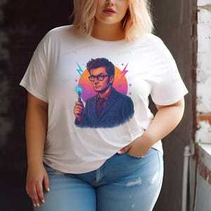 A woman wearing a white t-shirt with a graphic of a man holding a wand and a blue and orange background.