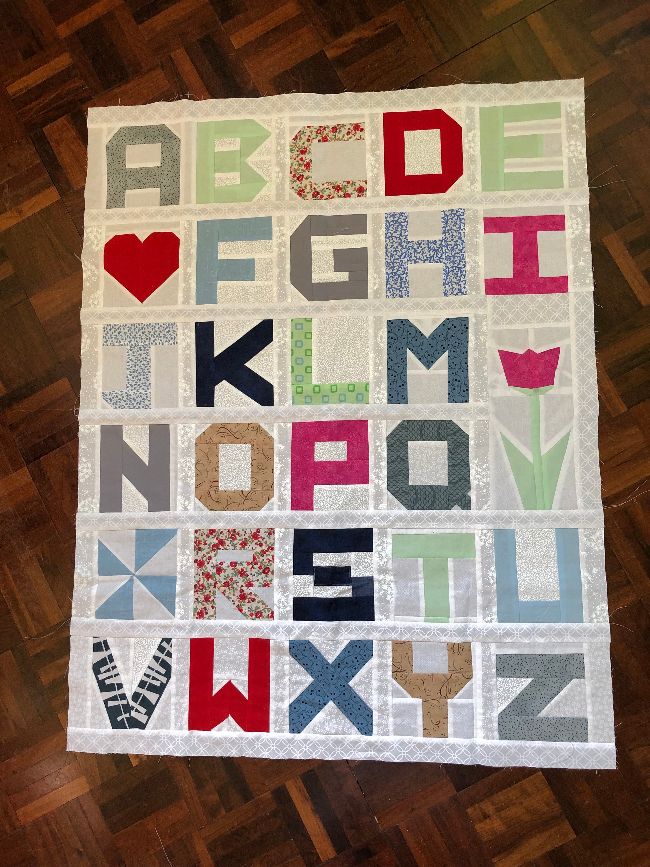 Alphabet baby quilt hotsell