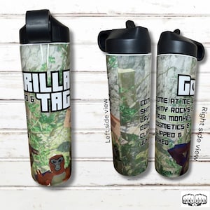 May include: Three cylindrical water bottles with black lids featuring a Gorilla Tag graphic print. The design includes a forest scene, a monkey character, and text reading Gorilla Tag, Come At Me Bro, Shiny Rocks, Lava Monkey, Cosmetics, Clipped, and Juked.
