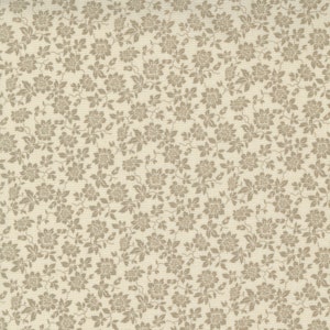 May include: A cream-coloured fabric featuring a repeating pattern of small, taupe floral designs. The detailed flowers and leaves create a delicate, all-over print. Ideal for quilting, clothing, or home decor projects.