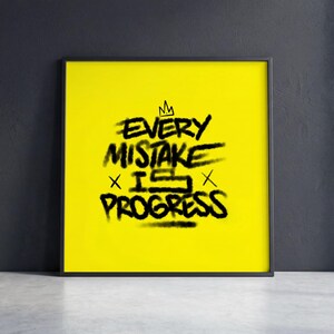 May include: A framed art print with a bright yellow background. The black text reads "EVERY MISTAKE IS PROGRESS" in a graffiti-style font, with a small crown above the word "EVERY". The frame is black.