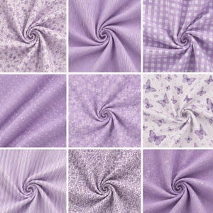 May include: Nine swatches of fabric in various shades of lavender. The fabrics include floral prints, gingham, polka dots, stripes, and butterfly patterns. The textures vary from smooth to textured, with a swirled presentation.