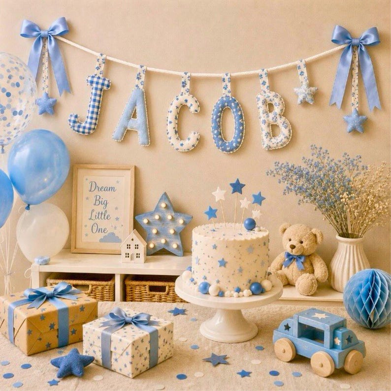 May include: A festive baby shower scene with blue and white decorations. Includes a cake, gifts, balloons, and a banner spelling "JACOB." The decor features stars, bows, and a wooden toy car, creating a celebratory atmosphere.