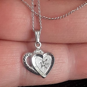 Sterling silver double heart with diamond center pendant necklace