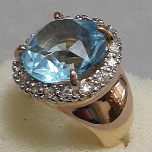 18kt GE Aquamarine color ring with rhinestones