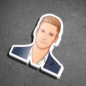 May include: A cartoon illustration of a man with short blond hair wearing a blue suit jacket. The man is looking directly at the viewer.