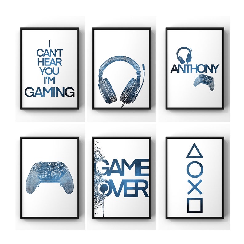 May include: Set of six blue and white gaming themed prints with black frames. The prints feature a controller, headphones, the words "Game Over", and the PlayStation button symbols.