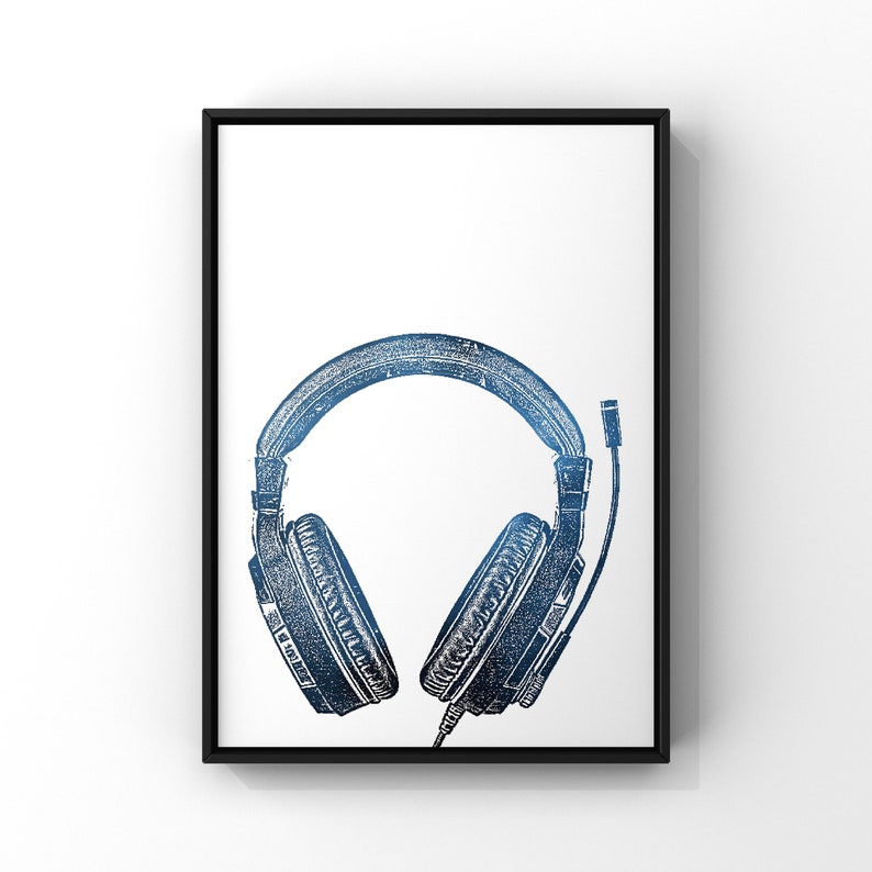 May include: A black framed print of a blue and white illustration of a pair of headphones.